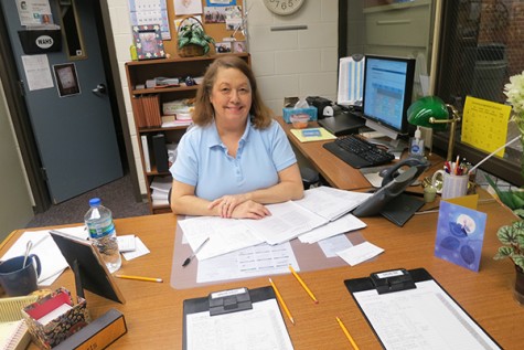 Mrs. Roberts happily looks over her long list of tardies