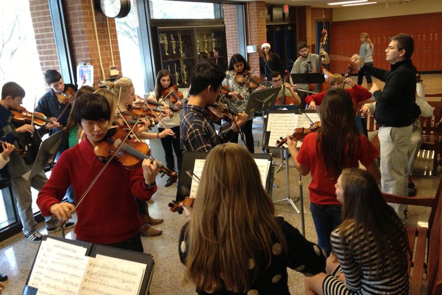 WAHS orchestra in a flash performance in the front of the school Friday afternoon