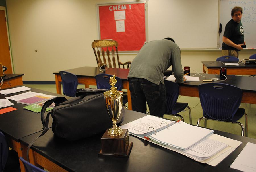 Starter Eric Xu calculates his stats at the New Kent tournament after the team won first place.
