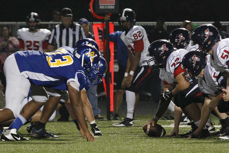 The Western defensive line sets up before snap. 