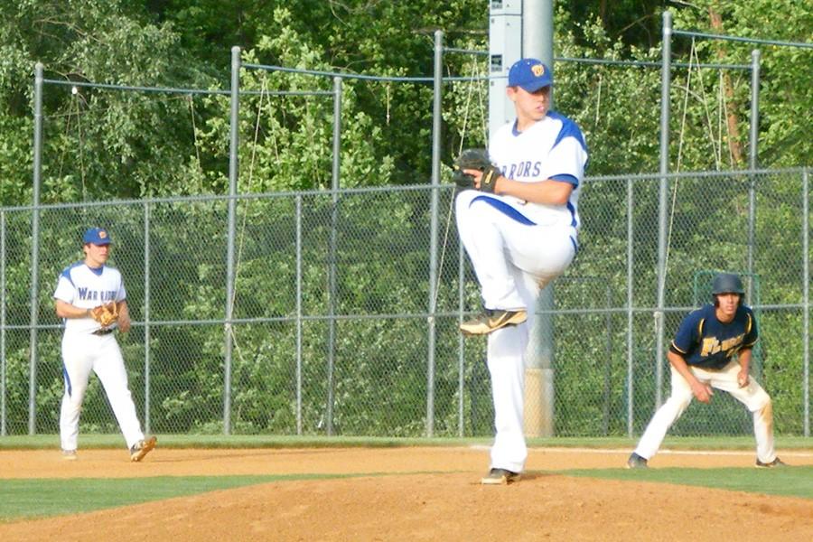 Josh Casteen winds up to throw a strike on the mound.