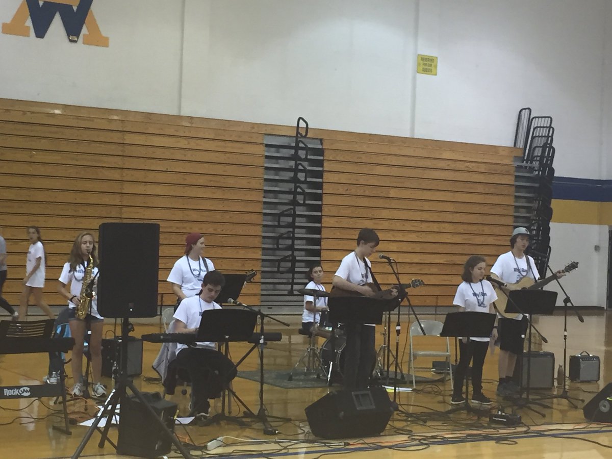 The members of Unintended Consequences perform at Why I Run. From left to right: Kirsten Casteel (saxophone), Alex Benson (bass), Eamon Dougherty (keyboard), Kathleen Hughes (drummer), Zach Thorne (guitar), Illiana Roèsso (lead vocals), and Josiah Luftig (guitar).