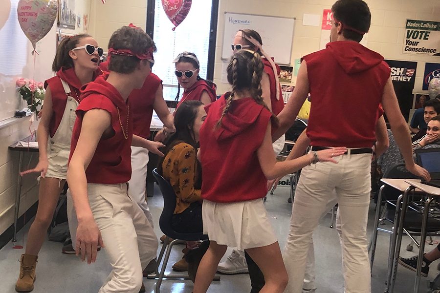 Senior Alice Ferrall receives a singing valentine from Johnny Riordan, Charlie Reichart, Savannah Wilson, Jed Strickland, Jane Romness, Abby Zimmerman, Teo Rampini, and Max Miller.