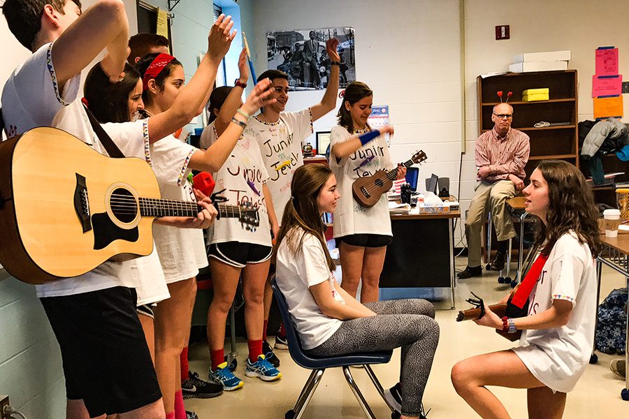 Sarah Lopez serenades Caroline McGahren while Owen Thacker, Mallory Murphy, Gigi Goldstein, Aislyn Boczek, Jackson Smith, and Reagan Burton sets the mood by waving in the background. This group performed “You Belong with Me” by Taylor Swift. 

