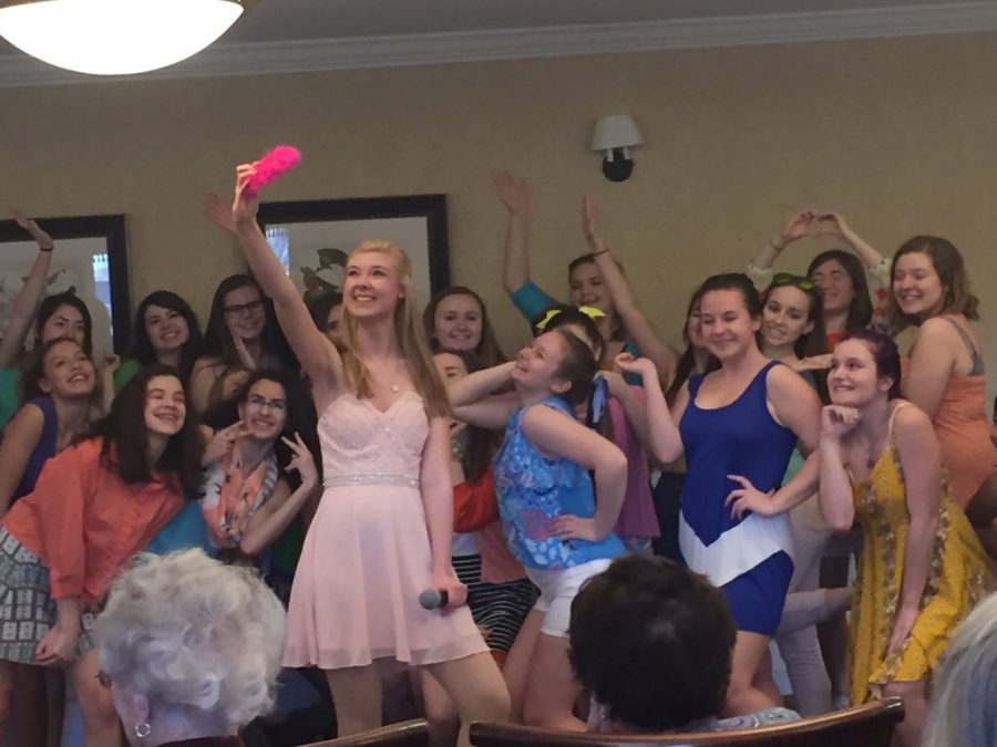 Chloe Horner (Elle) initiates a selfie with Delta Nu girls at a preview performance at the Old Trail Lodge