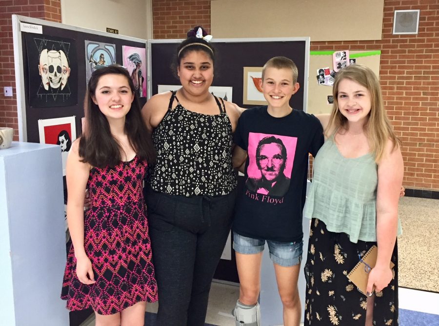 Gayathri Prakash with her fellow senior artists at the Senior Art Show. From left to right: Laura Bendick, Gayathri Prakash, Zoe Clay, and Emma Schmidt.