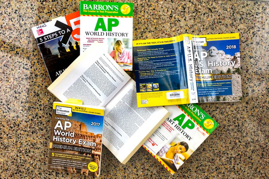In+place+of+the+stringently+regulated+College+Board+logo%2C+The+Western+Hemisphere+decided+to+feature+a+%2Acompletely%2A+unstaged+mess+of+AP+review+books+scattered+on+the+floor+in+C-hall.