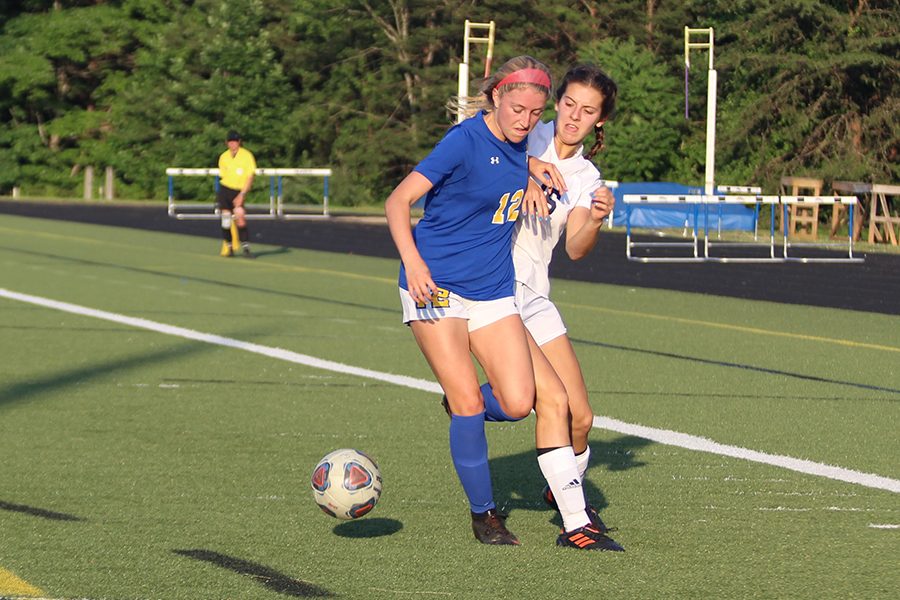 Julia Berg battles for the ball.