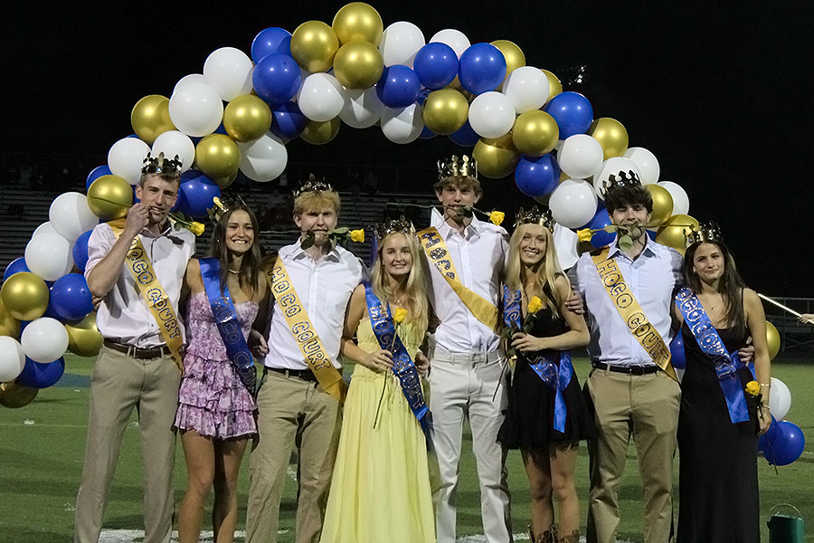 The senior homecoming court poses on the football field (left to right: Jack Schmitz, Juliana Murphy, Aiden Bakich, Lily Anderson, Harrison Kinsey, Lydia DeRenouard, Jack Steenburgh, and Eva Yale. 