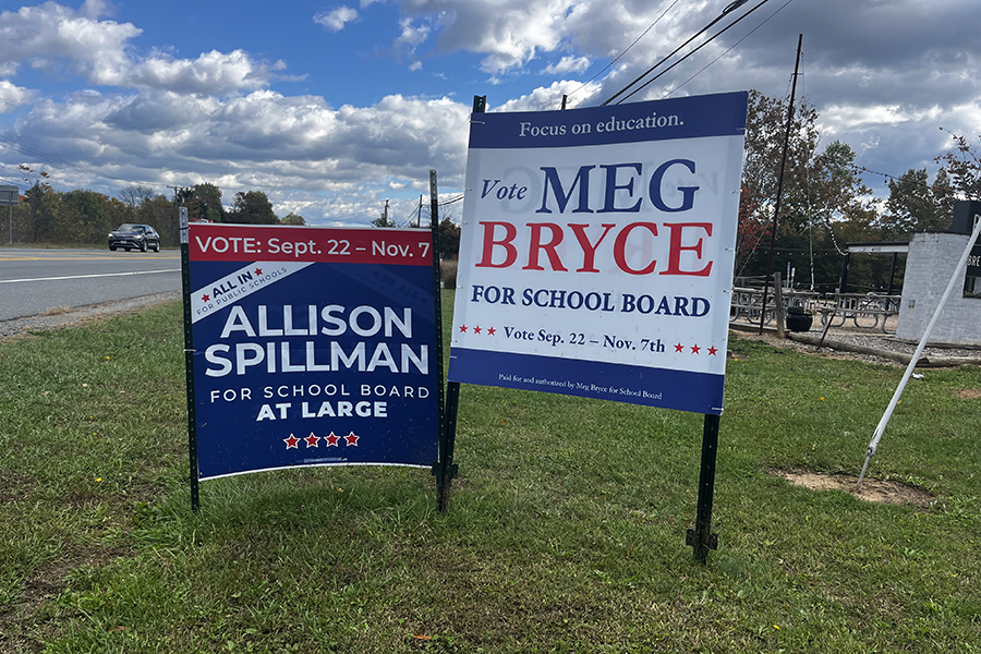 Opposing signs for candidates Allison Spillman and Meg Bryce. 