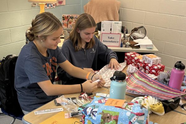 Lucy Coward and Riley Bishop wrap presents for the Angel Tree charity in Leadership. Class president Kylee Hughes commented, The last day of fundraising the school really pulled through, and we exceeded our goal.