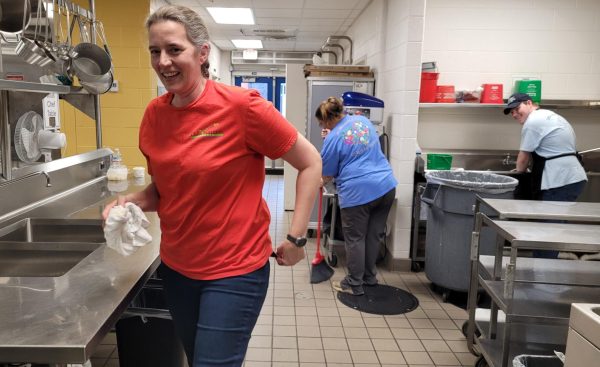 McMurray, Hunt, and Crowder prepare the kitchen for another day of work. 